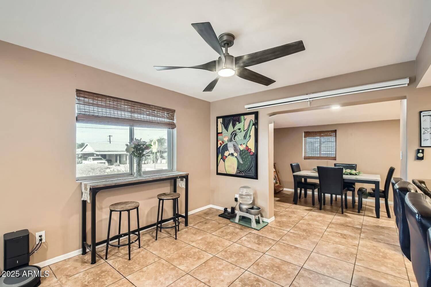 9031 North 14th Street Phoenix, AZ 85020 - Photo 10 of 33 a view of a dining room with furniture window and outside view