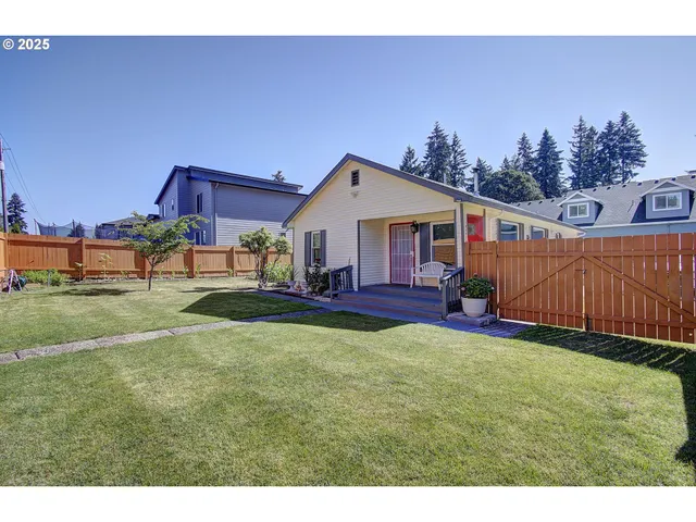 a view of a house with a yard porch and sitting area