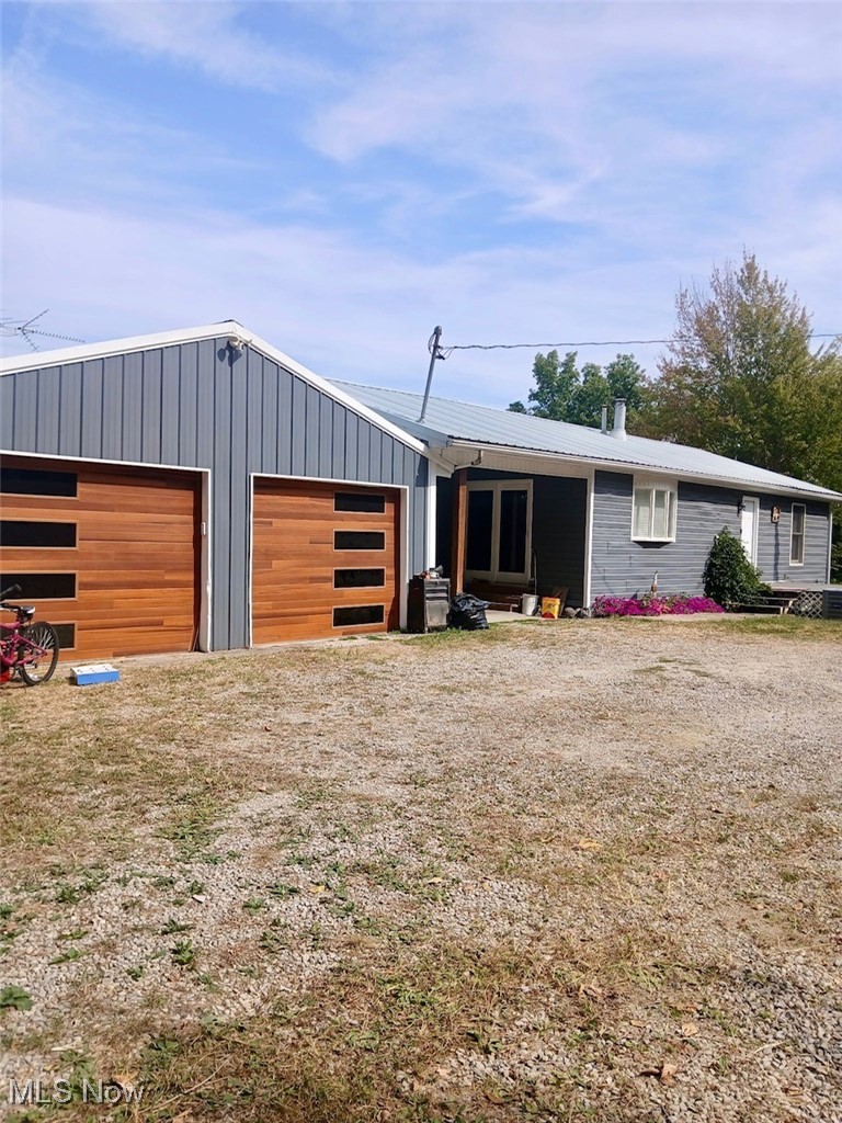 View of front of home with a metal roof