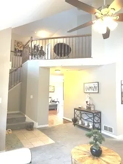 a living room with furniture and a rug