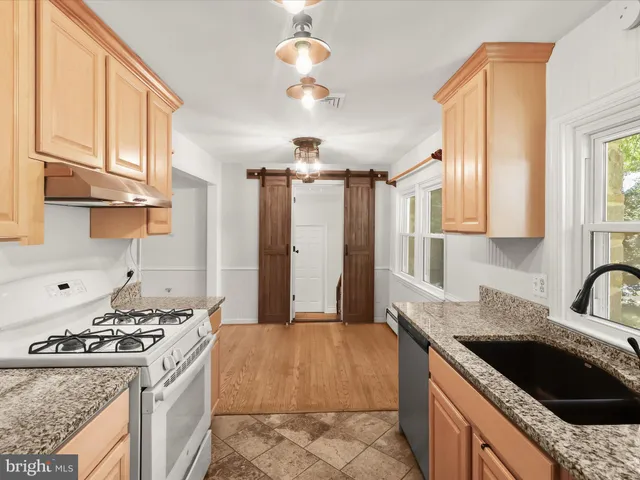 a kitchen with a stove and a sink