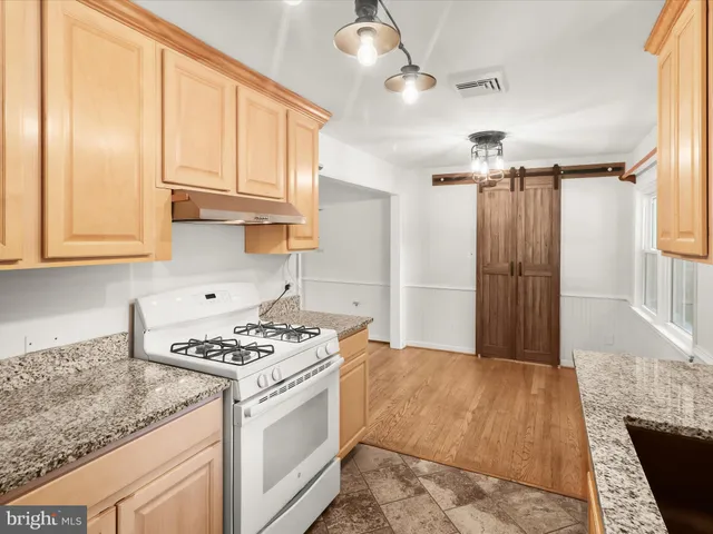 a kitchen that has a cabinets and a stove