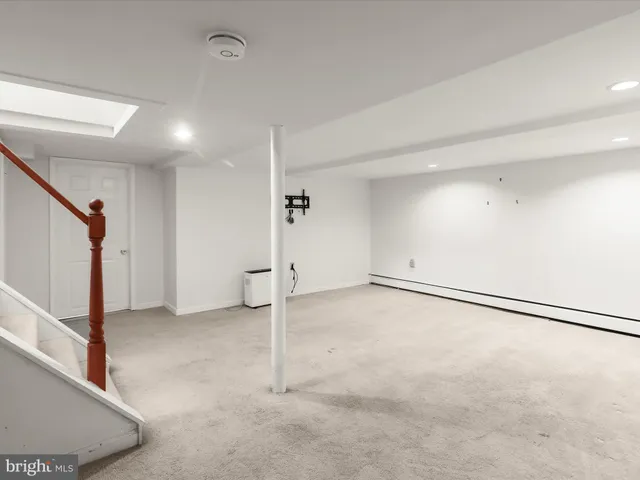 a view of room with stairs and entryway