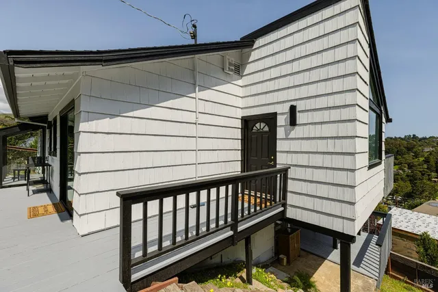 a view of a balcony with a potted plant