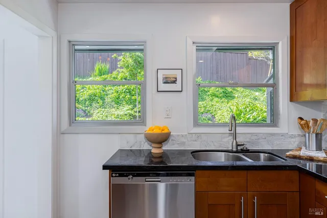 a spacious bedroom with a bed and window