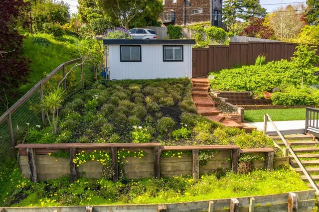 an aerial view of residential house and green space