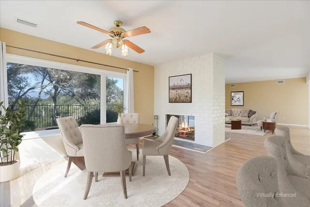 a kitchen with granite countertop white cabinets white stainless steel appliances and a sink