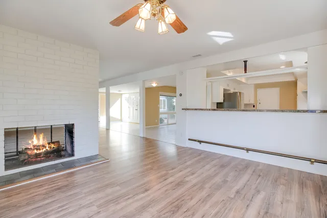 a bathroom with a granite countertop sink mirror and bathtub