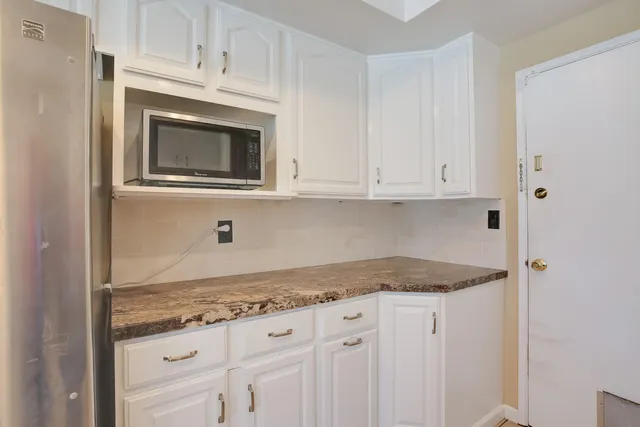 a bathroom with a shower and a toilet