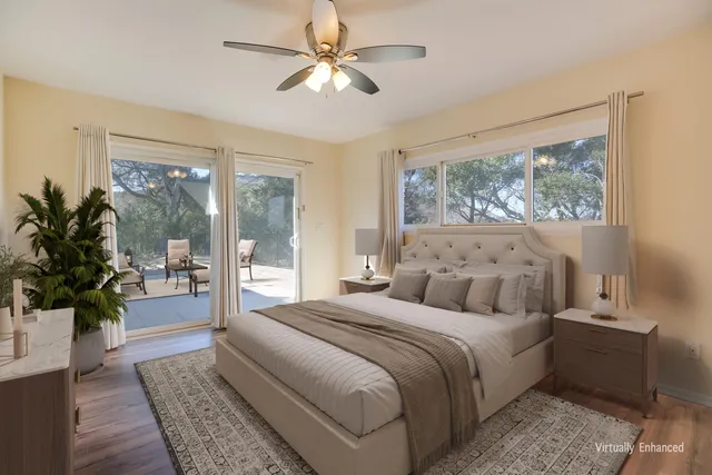 a view of empty room with wooden floor and fireplace