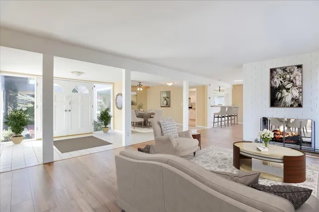a kitchen with white cabinets and appliances