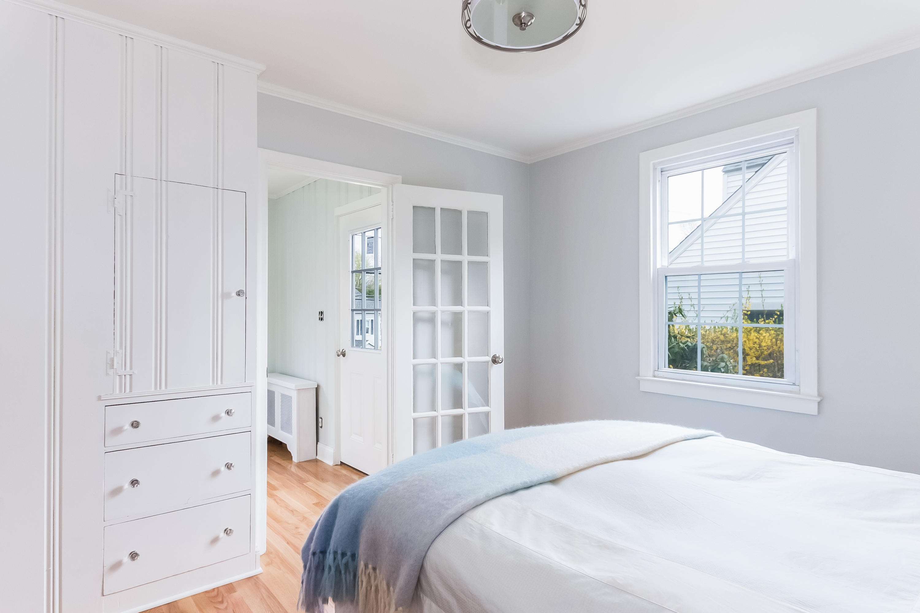 1 Walmsley Road Darien, CT 06820 - Photo 15 of 27 a bedroom with a bed and a window