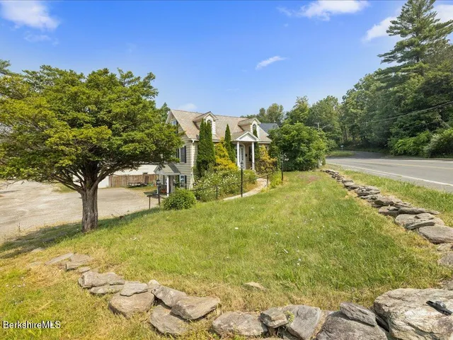 a view of a yard with an outdoor space