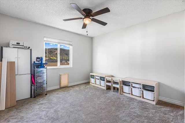 a bedroom with a bed and a table