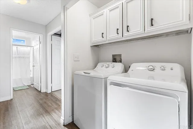 a view of an outdoor space with furniture and umbrella