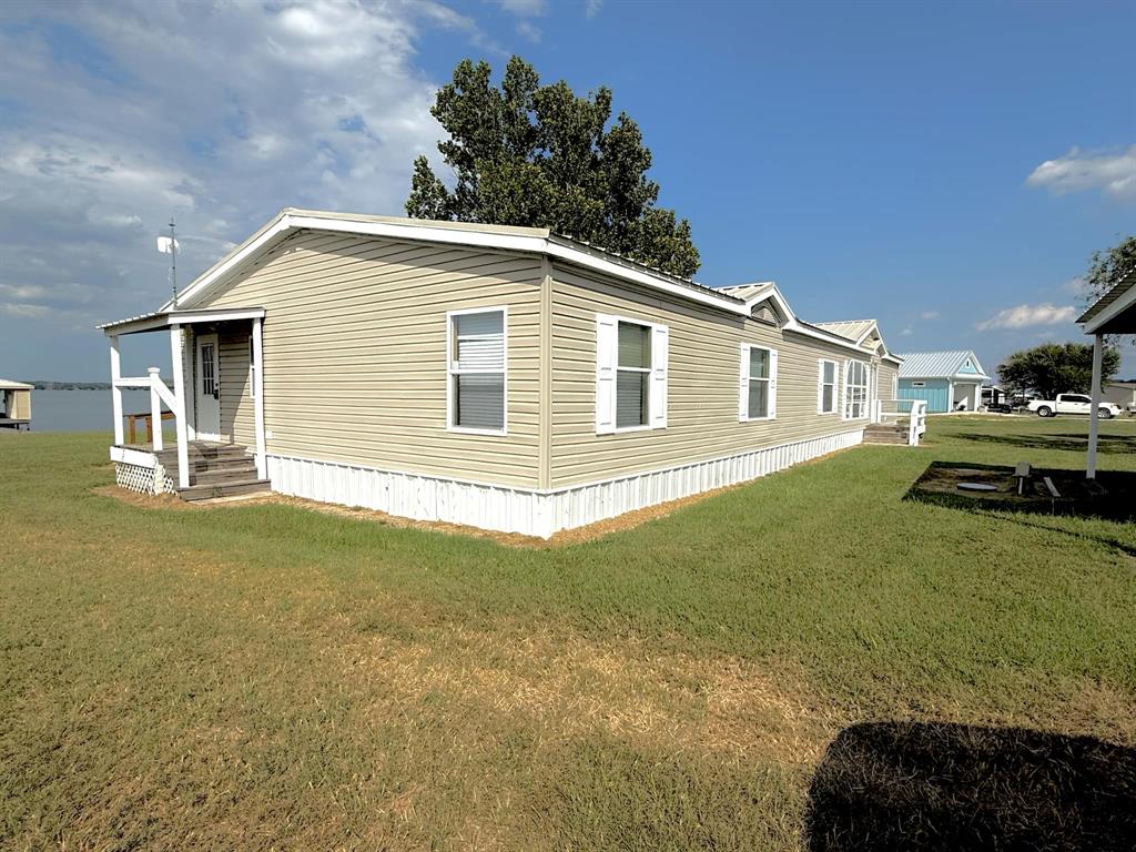 260 Lcr 751 Road Thornton, TX 76687 - Photo 2 of 40 a front view of a house with a garden
