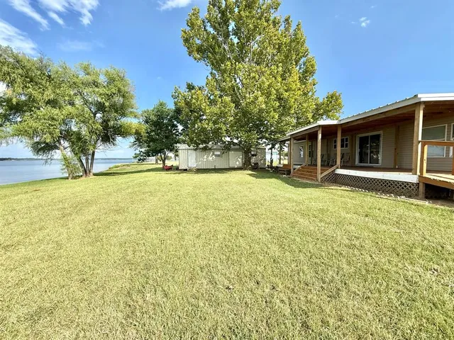 a view of a swimming pool with an outdoor space and seating area
