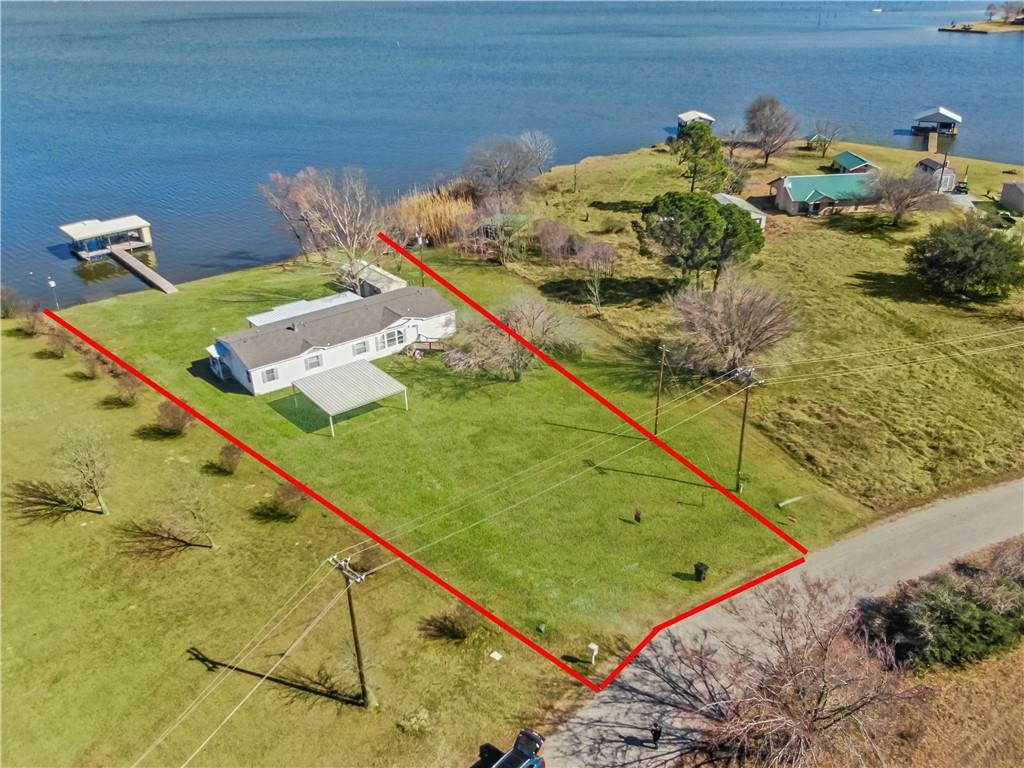 260 Lcr 751 Road Thornton, TX 76687 - Photo 37 of 40 a bed sitting in a bedroom next to a larger window