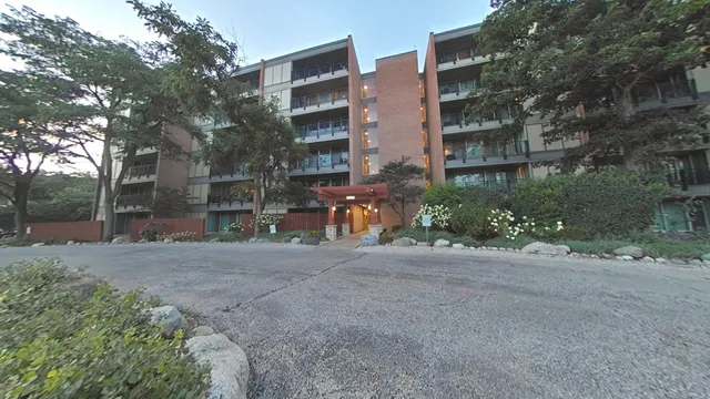 a view of a street with a building in the background