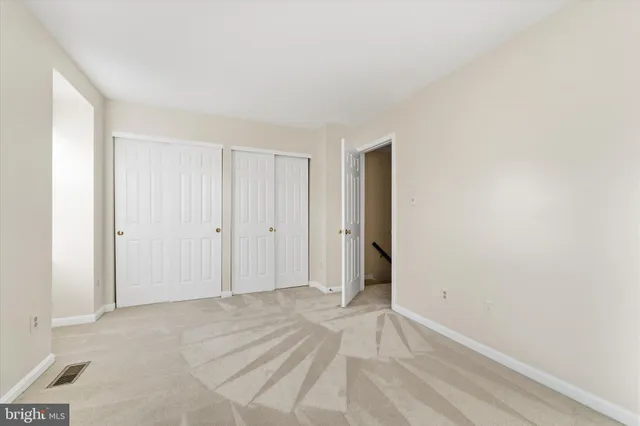 a bathroom with a sink and mirror with toilet