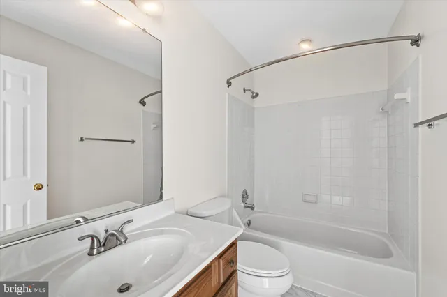 a front view of a house with balcony and furniture