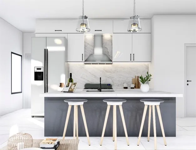 a view of kitchen with kitchen island stainless steel appliances sink stove and refrigerator