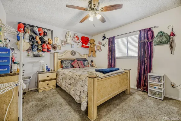a bed room with a bed and a baby bed