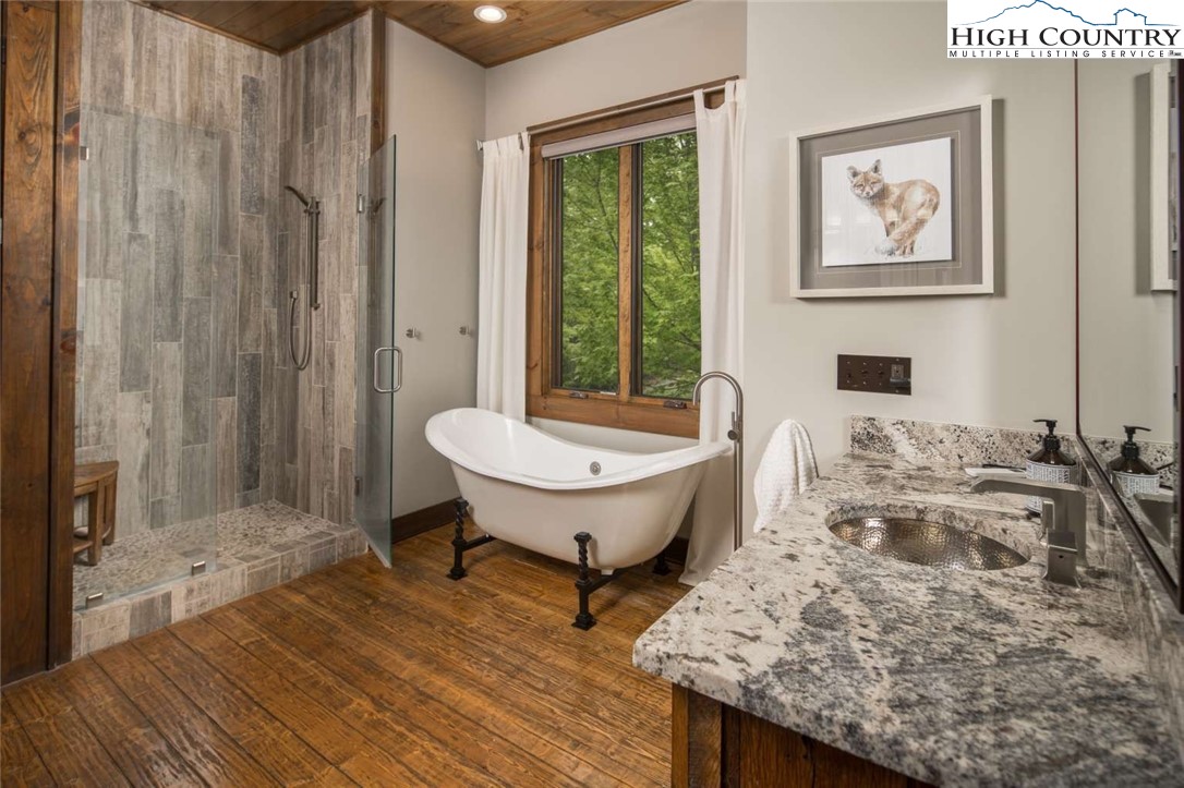 856 Ninebark Road Boone, NC 28607 - Photo 16 of 30 a view of a bath room with a bath tub and sink