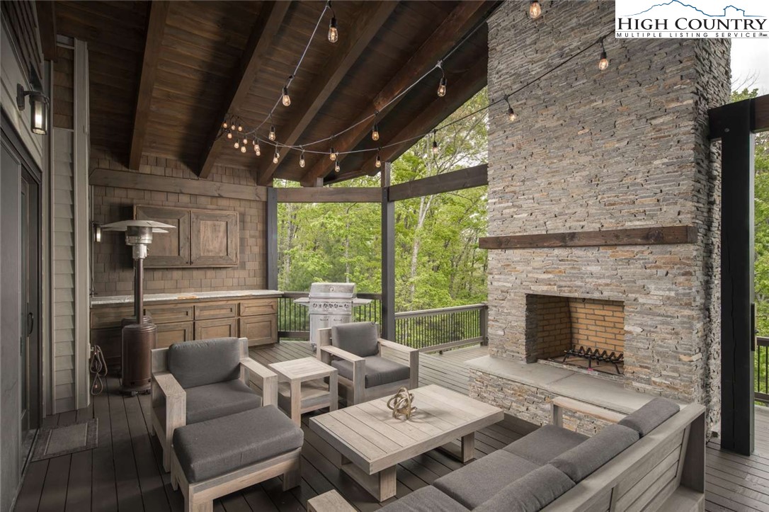 856 Ninebark Road Boone, NC 28607 - Photo 25 of 30 a living room with furniture and a fireplace