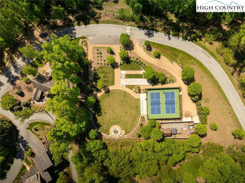 856 Ninebark Road Boone, NC 28607 - Photo 28 of 30 an aerial view of a house with swimming pool and large trees