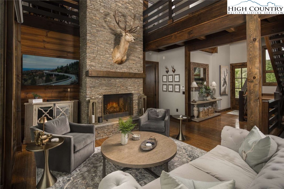 856 Ninebark Road Boone, NC 28607 - Photo 5 of 30 a living room with furniture and a fireplace