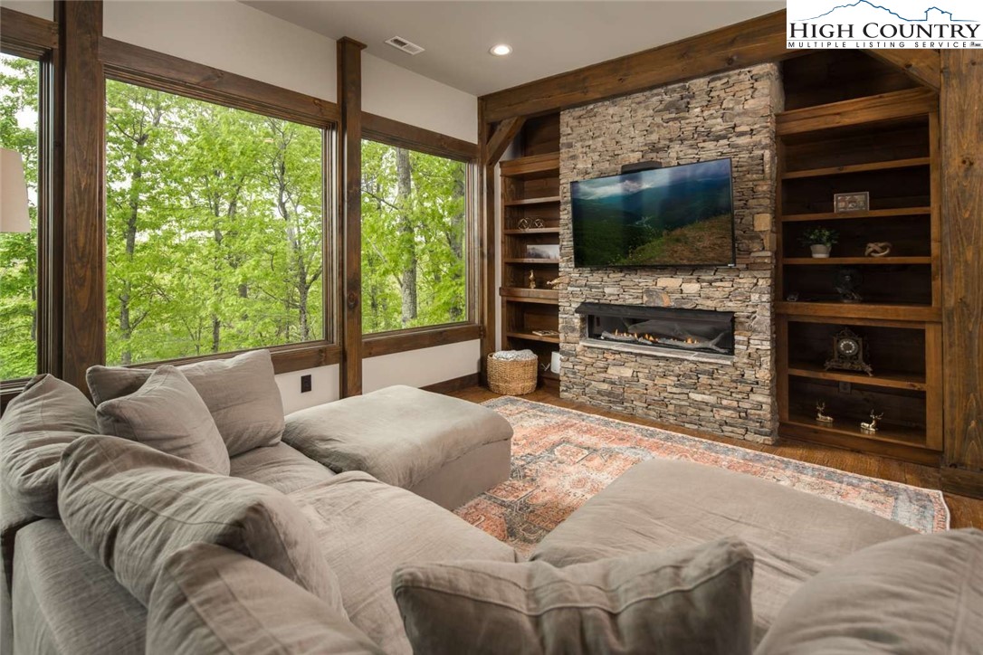856 Ninebark Road Boone, NC 28607 - Photo 10 of 30 a living room with furniture and a flat screen tv