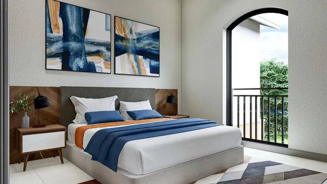 a bedroom with a bed and a painting on the wall
