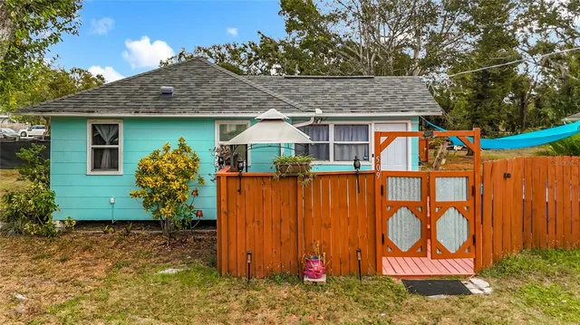 a view of a house with a sink and wooden floor