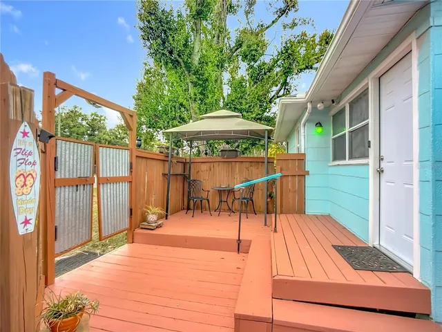 a view of a backyard with a patio