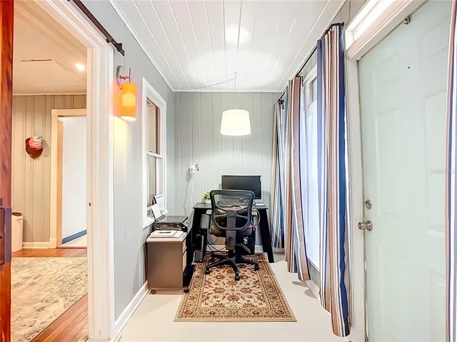 a very nice looking room with a large mirror on a table and chairs