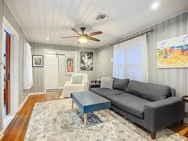 a living room with furniture and a rug