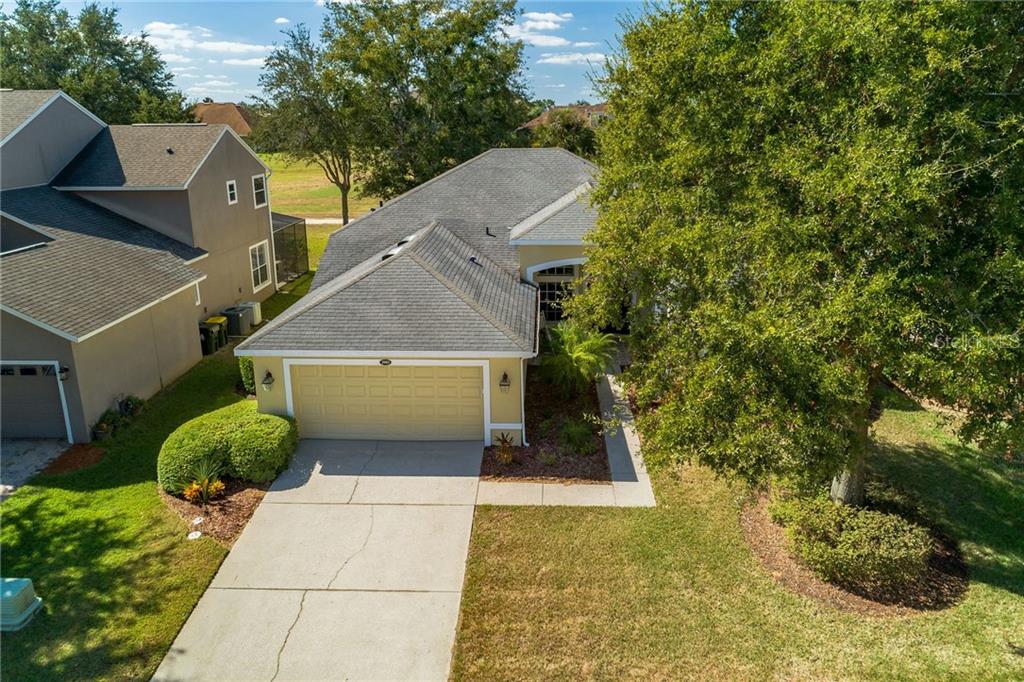 3985 Beacon Ridge Way Clermont, FL 34711 - Photo 1 of 1 a view of a house with a yard and a garage