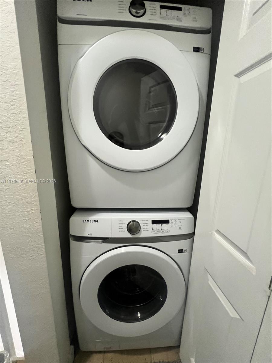 9031 Southwest 227th Street, Unit 2 Cutler Bay, FL 33190 - Photo 13 of 16 a utility room with dryer and washer