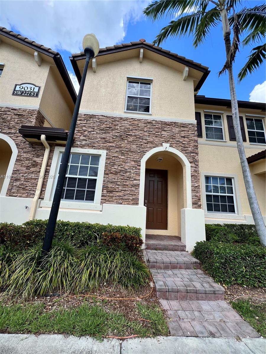 9031 Southwest 227th Street, Unit 2 Cutler Bay, FL 33190 - Photo 2 of 16 a front view of a house