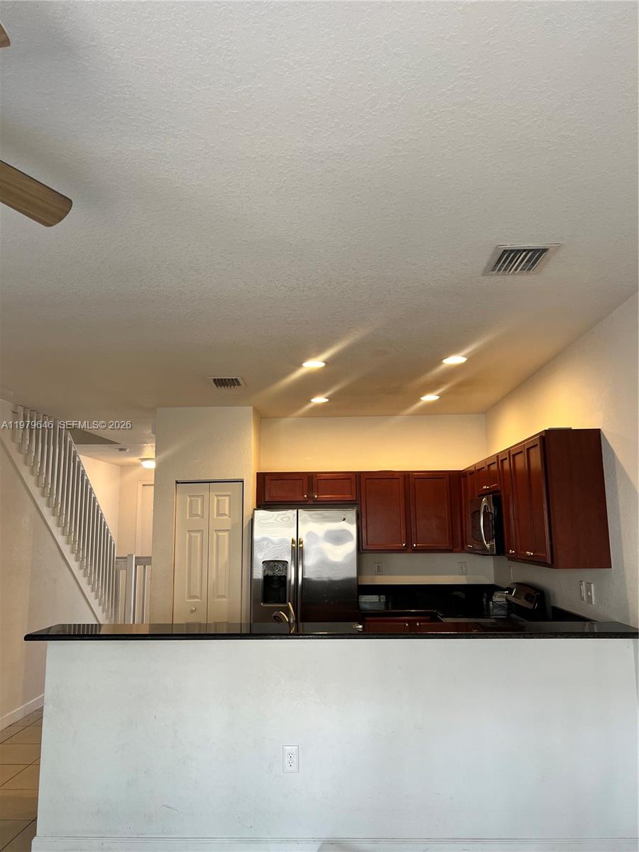 9031 Southwest 227th Street, Unit 2 Cutler Bay, FL 33190 - Photo 5 of 16 a view of a car garage