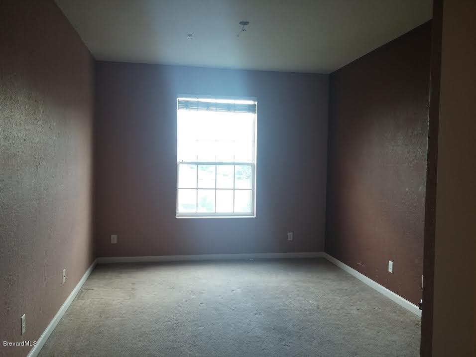 3848 Lexmark Lane, Unit 306 Rockledge, FL 32955 - Photo 8 of 13 Master Bedroom