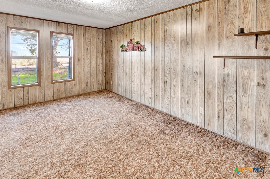 10957 Highway 77 Schulenburg, TX 78956 - Photo 15 of 35 a view of an empty room with a window