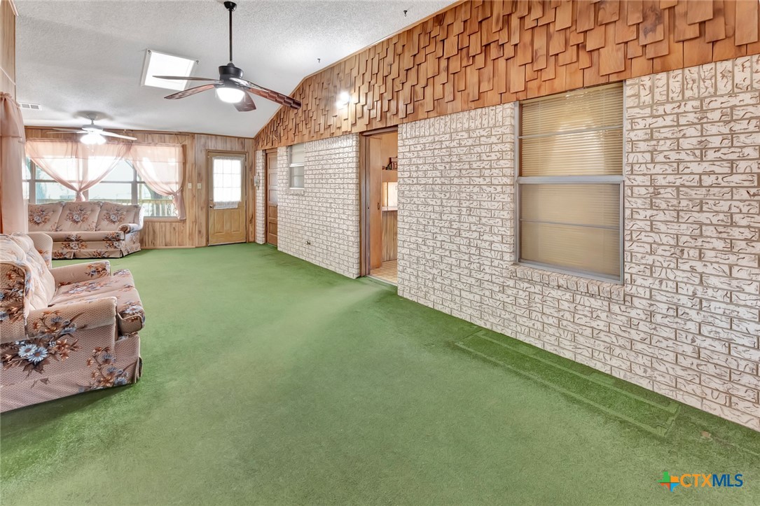 10957 Highway 77 Schulenburg, TX 78956 - Photo 17 of 35 a bathroom with a sink a large mirror and a shower