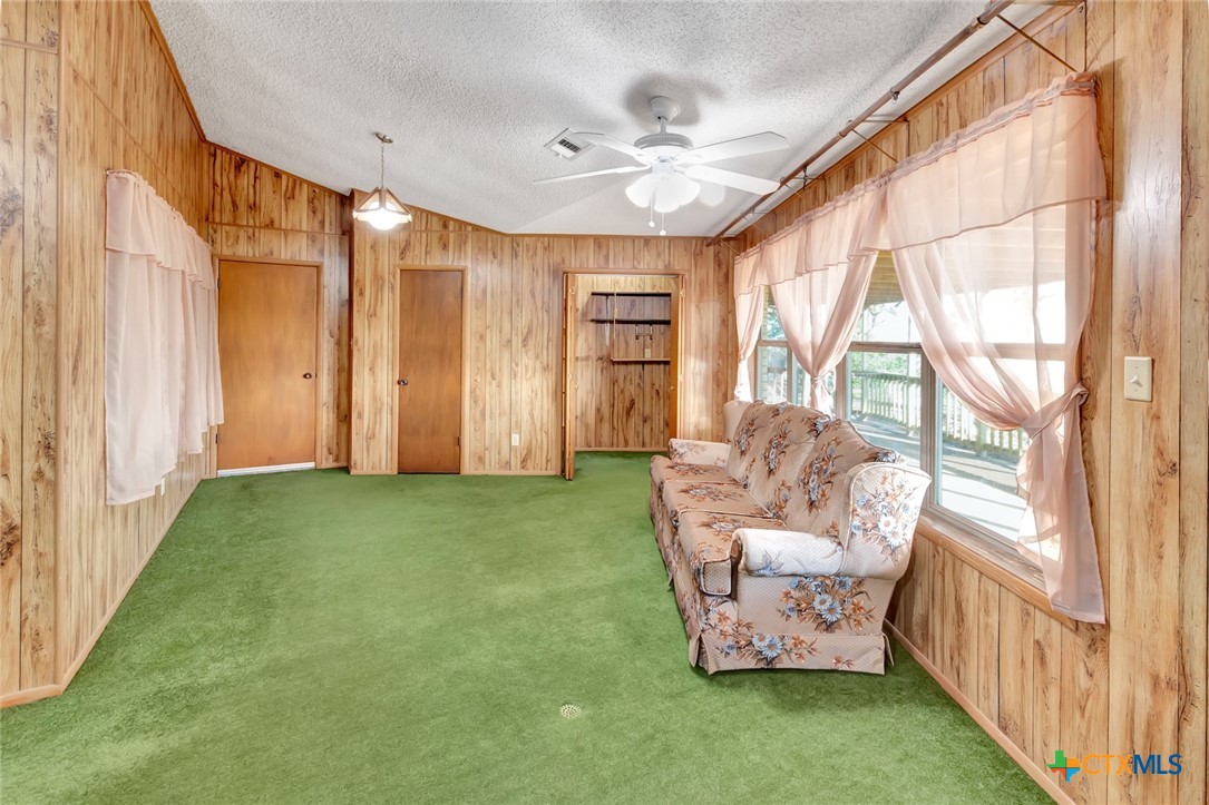10957 Highway 77 Schulenburg, TX 78956 - Photo 18 of 35 a living room with furniture and a large window