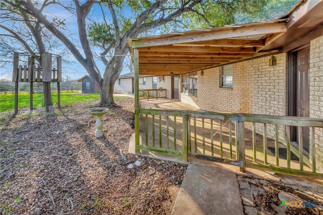 10957 Highway 77 Schulenburg, TX 78956 - Photo 28 of 35 a view of a house with a yard and wooden fence