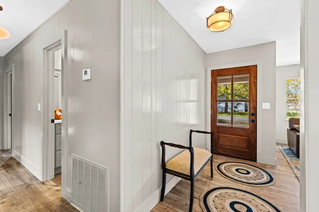 a view of a livingroom with furniture and a window