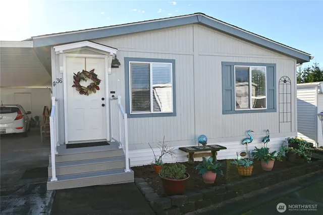 a front view of a house with sitting area
