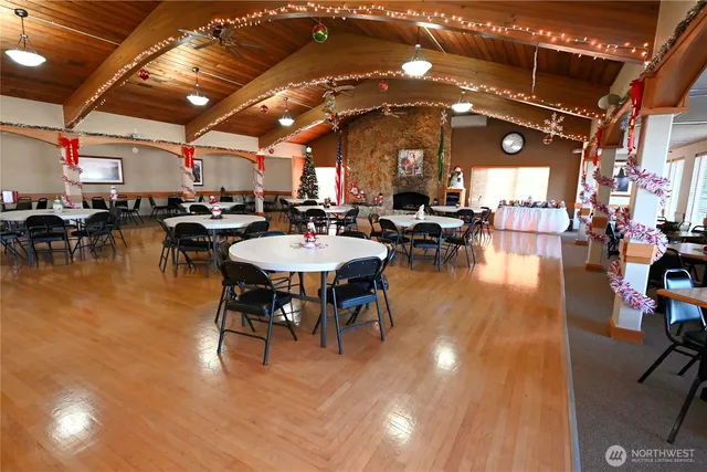 a view of a swimming pool with outdoor seating