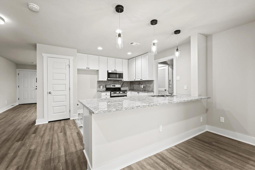 5629 Maceo Lane Fort Worth, TX 76112 - Photo 22 of 25 a kitchen with stainless steel appliances a refrigerator sink and cabinets